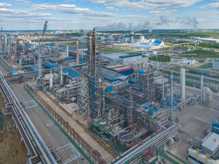 Wall Mural - Aerial view of high fractional column in chemical plant.