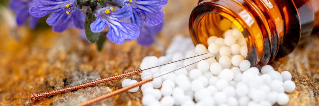 Fototapete -  alternative medicine and care with herbal pills and acupuncture