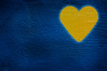 Yellow Heart Painted On Blue Wall
