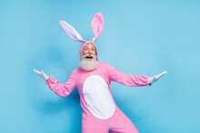 Photo Of Positive Charming Man Pensioner Dressed Pink Rabbit Nightwear Dancing Smiling Isolated Blue Color Background