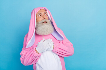 Poster - Photo of speechless staring pensioner guy dressed bunny kigurumi looking empty space isolated blue color background