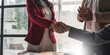 © wichayada - Business people shaking hands, finishing up meeting, business etiquette, congratulation, merger and acquisition concept.