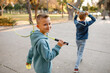 Children play badminton in the park.