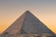A view of the huge pyramid of Cheops, Giza, Egypt at sunrise.	
