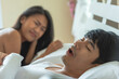 © BESTIMAGE - Husband snoring in bedtime. wife suffer unhappy and not sleeping because noise from snoring