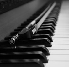 Piano Keyboard With A Violin Bow