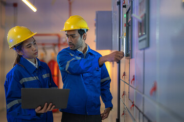 Team Asian man and woman engineer of mechanical checking system and meeting inspection. Worker has proudly his job. Concept Engineer Operating and control in Factory with safety.