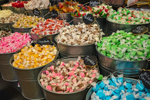 Buckets Filled With Taffy Candy At A Candy Shop. A Variety Of Candy In A Store