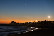 Sitges Terramar Beach In The Night With Waxing Crescent Moon