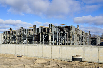 Canvas Print - Industrial building wall construction using concrete formwork with a folding mechanism