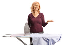 Tired Mature Woman With An Ironing Board