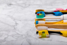 Electric, Bamboo And Ordinary Toothbrushes On A Colored Background. Oral Hygiene. Eco. Prevention Of Caries. Dental Car. The Concept Of Dentistry And Eco-friendly Lifestyle.Place For Text.
