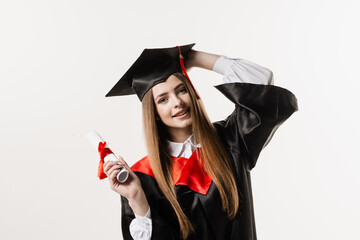 Wall Mural - Happy graduate girl smiling and holding diploma with honors in her hands on white background. Graduation. Graduate girl graduated from university and got master degree.