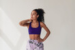© mary_markevich - attractive black african american woman in stylish hipster fitness outfit on isolated background