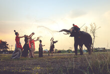 Elephants And Tourism Splashing Water Flighting On Sonkran Festival In Ayutthaya  Historical Park , Thailand