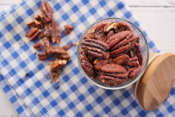 Poster - Tasty pecan-nut in a jar on table 