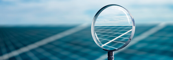 Wall Mural - solar panel at sunset focused with a magnifying glass