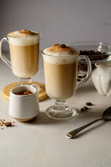 Wall Mural - Two cups with coffee drink, latte or mocha with milk foam and cinnamon