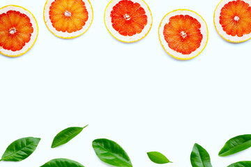 Wall Mural - High vitamin C. Juicy grapefruit slices on white.