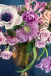 Beautiful bouquet of spring flowers in a vase on the table. Lovely bunch of flowers. Soft focus. 