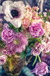 Beautiful bouquet of spring flowers in a vase on the table. Lovely bunch of flowers. Soft focus.

