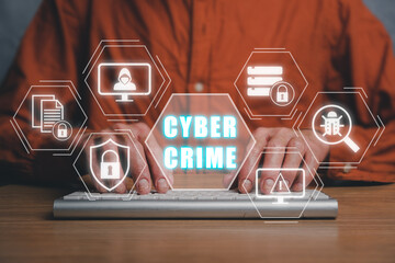 Cyber crime concept, Person hand typing on keyboard computer with cyber crime icon on virtual screen, Big data personal information safety technology concept.