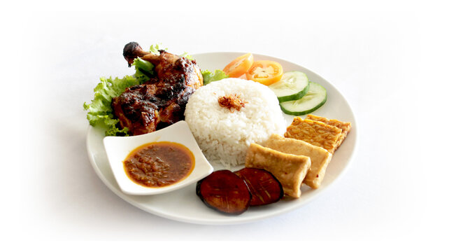 rice with grilled chicken also traditional sambal with tahu tempe