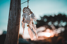 Close-up Of Dreamcatcher Against Cloudy Sky During Sunset, Dreamcatcher Is A American Native Amulet On Sunset. Shaman