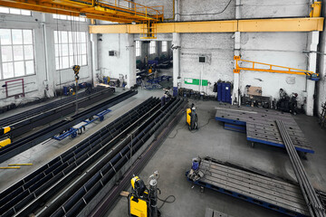 Wall Mural - Long steel constructions assembling with welding in workshop