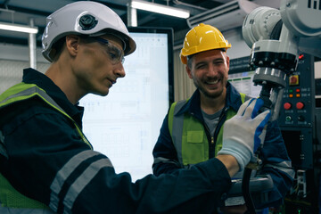 Wall Mural - Multiracial tachnicial engineer training with robot arm