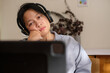 © weedezign - asian woman feel bored when video conference meeting at home