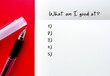 © ariya j - Pen and notebook on red background with handwritten text WHAT AM I GOOD AT? question to find out who you are, reveals true passion which could be your expertise and what you should do