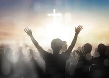 Silhouette Human Raising Hands To Praying God On Blurred Cross  Background