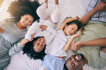 Poster - Happy, relax and morning with black family in bedroom from top view for wake up, bonding and affectionate. Weekend, smile and care with parents and children at home for playful, funny and free time