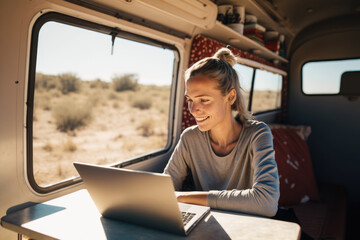 digital nomad woman using laptop inside her camper van, happy developing her passion on a sunny day.