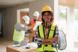 Foreman builder woman at construction site. American African foreman construction standing at construction site