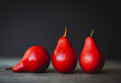 © Cavan Images - Close-up of fresh red pears on table
