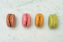 Above View Of Colorful Macaroons On A Marble Background