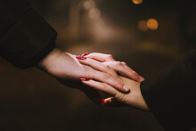 Closeup Of White Hands Together In Love In Countryside