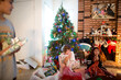 © Cavan Images - Girls react to their presents at Christmas