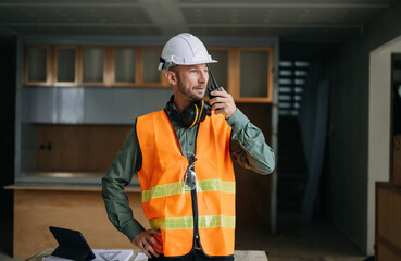 Handsome man team architect on a building industry construction site.