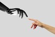 Artificial intelligence, future technology and business concept - robot and human hand. A person reaching out to a robot.