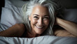 © Gelpi - Sincere smile of an exultant mature woman with white hair waking up. Generative AI