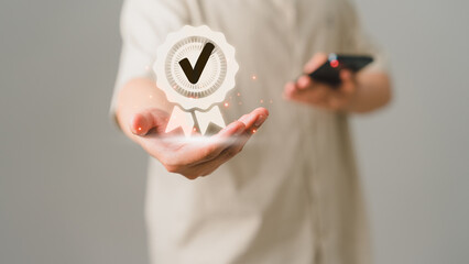 Fototapete - Quality assurance of business services, Businessman holding and showing the best quality assurance.. Guarantee, Standards, ISO certification and testimonial concept.