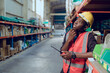 © Wosunan - Portrait of warehouse workers in a large warehouse with their own preparation for the day's work