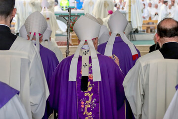 bishops in procession to the church altar to celebrate mass