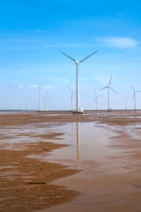 Seascape with Turbine Green Energy Electricity, Windmill for electric power production, wind turbines generating electricity on the sea at Bac Lieu province, Vietnam