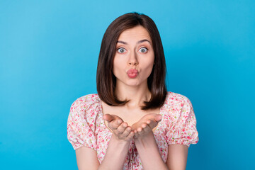 Poster - Closeup photo of young attractive pretty cute girl hold hands sending air kiss lover look you isolated on blue color background