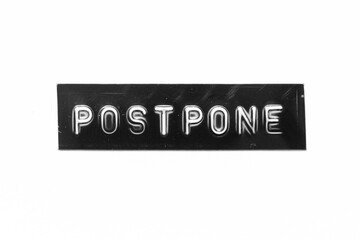 Sticker - Black color banner that have embossed letter with word postpone on white paper background