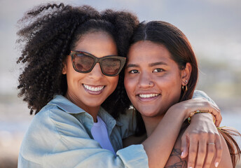 Wall Mural - Women, lgbtq and happy beach portrait for love, hug and care on summer holiday, vacation and rainbow pride. Gay, lesbian and young couple of friends relax at sea, ocean or outdoor happiness in nature